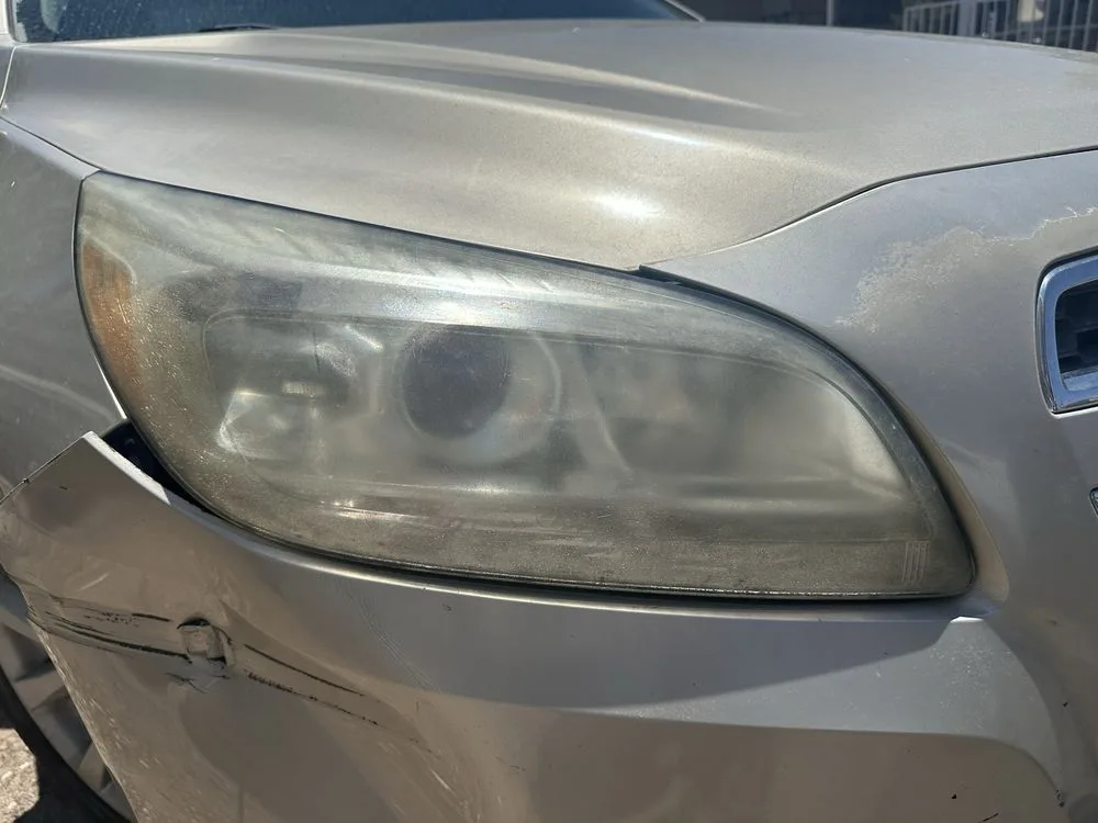 Close view of oxidized headlight before restoration